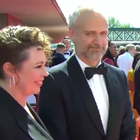 Both Olivia Coleman and Ed Sinclair are dressed in black.